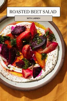 roasted beet salad with labneh in a bowl on a yellow tablecloth