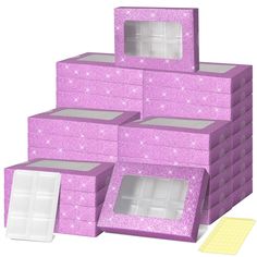 a stack of purple boxes sitting next to each other