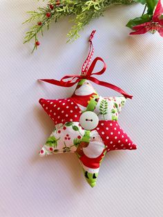 an ornament made out of fabric is sitting on a table