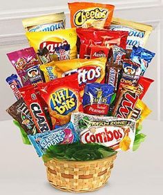 a basket filled with lots of different types of candy and snacks in it's wrappers