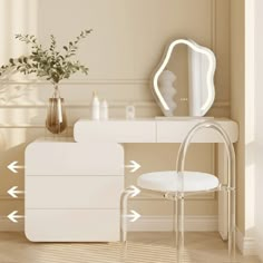 a white dressing table with mirror, stool and vase on it next to a plant