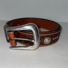 Roper Western Belt Men's Floral Hand Tooled Leather Brown 8579500 Size 32 Top Grain Leather Silver-Tone Studs Silver Flower Conchos New With Tags Total Length: 39” Shortest Hole: 32” Longest Hole: 36” Width: 1.5” Western Belt, Hand Tooled Leather, Western Belts, Tooled Leather, Leather Silver, Top Grain Leather, Silver Flowers, Leather Tooling, Mens Belts