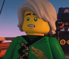 the lego movie character looks angry as he stands in front of a train and watches