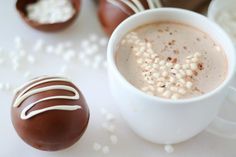 a cup of hot chocolate with marshmallows on the side