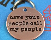 a metal keychain with the words have your people call my people on it