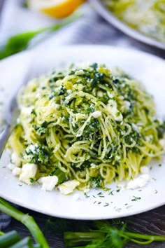 a close up of a plate of food with broccoli and fettuccine