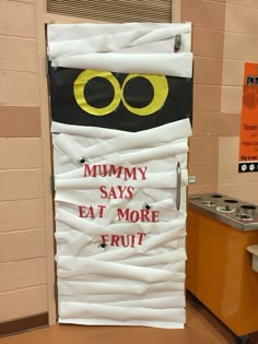 a door decorated to look like a monster with the words'mommy says eat more fruit '