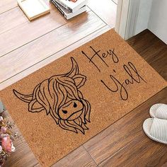 a door mat with the words happy new year and a cow's head on it