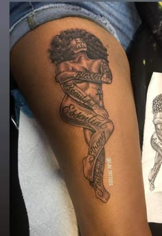 a woman's leg with a tattoo on it that has words and an image of a man