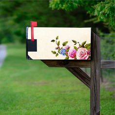 a mailbox with flowers painted on it