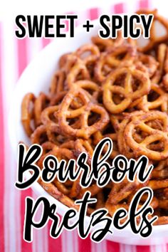 sweet and spicy bourbon pretzels in a white bowl on a striped tablecloth