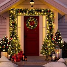 a house decorated for christmas with wreaths and lights