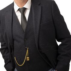 A Gold-colored pocket chain with a charm by the pocket is an elegant accessory that adds sophistication to every outfit. With different lengths (from 8 to 18 inches), the chain can be adjusted to individual needs. It will be a perfect choice for a suit, blazer, or pants with a classic background. Its universal character makes it a great gift for everyone - men and women. Regardless of the occasion - birthdays, name days, or holidays - it will definitely please every recipient. T-Bar measure: 30m Fancy Fits, Silver Pocket Watch, Pocket Watch Chain, Name Day, Business Suit, Watch Chain, Professional Attire, Suit Vest, Wallet Chain