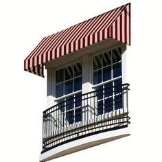 a black and white striped awning over a balcony