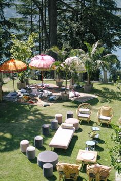 an outdoor area with lawn furniture and umbrellas