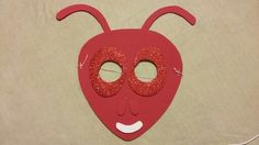 a red mask with eyes and ears on it