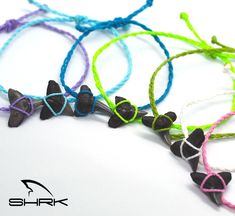 several different colored cords with black and white bows