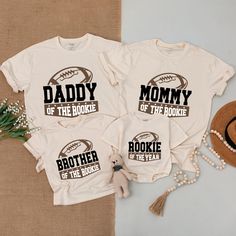 three shirts that say, daddy of the hockie and brother of the football player