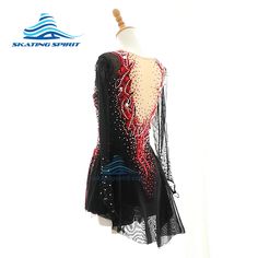 a black and red dress with sequins on the back, sitting on a mannequin