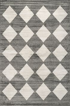 a gray and white rug with diamonds on the top in different sizes, shapes and colors