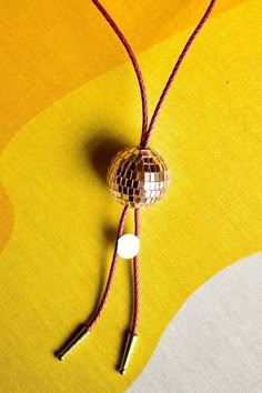 Howdy fellow disco cowpokes! Never make the fashion sacrifice between business and party when a formal disco bolo-tie is an accessory option. Handmade in Denver whilst listening to Abba exclusively.  Primary Color - Disco Ball Secondary Color - Rope/Cord Disco Cowboy Outfit, Diy Bolo Tie, Western Disco, Disco Cowboy, Disco Aesthetic, Cowgirl Bachelorette Parties, Western Bolo Tie