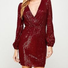 Twinkle Under The Lights In This Sequin Dress Perfect For Party Season! It Features Long Sleeves, A Surplice V-Neckline. The Lined Knit Fabric Offers A Moderate Stretch. Complete The Look In Suede Booties. Material: 95% Polyester, 5% Spandex Measurements: S- Bust 35", Waist 27, Hips 35", M- Bust 37", Waist 29, Hips 37" L- Bust 39", Waist 31, Hips 39" Fitted V-neck Sequin Dress For Festive Occasions, Red V-neck Mini Dress For Holiday, Red V-neck Party Season Dresses, Red V-neck Mini Dress For Party Season, Holiday Cocktail Mini Dress With V-neck, V-neck Mini Dress For Holiday Party, Elegant V-neck Mini Dress For Christmas, Holiday Party V-neck Mini Dress, Glamorous V-neck Mini Dress For Christmas