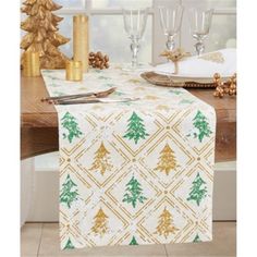 a christmas table runner with gold and green trees on it