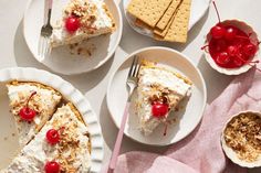 three plates with desserts on them and one has a fork in it, the other has cherries