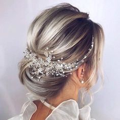 a woman wearing a bridal hair comb