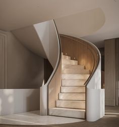 a spiral staircase in the middle of a room with beige walls and carpeted flooring