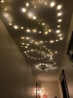 a long hallway with lights on the ceiling