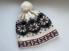 This winter hat with Norwegian pattern is extra warm, protecting a head in cold and windy weather. This winter hat has a wool inner making it comfortable to wear. This hat can be a perfect gift for Christmas. The hat is made of 100% natural wool from sheep, which assures natural and environmental friendliness. All wool items in my shop are washed - Ready to wear! Material: 100% wool Colours: -White/Black Sizes: *Head circumference: 54-56cm (21.26-22.05in) Hat height: 23cm (9.06in) *57-59cm (22.4 Knitted Winter Bonnet Cap, Warm Hat For Winter Sports, Warm Winter Cap, Winter Bonnet For Cold Weather, Winter Brimmed Knitted Bonnet, Brimmed Winter Bonnet For Cold Weather, White Winter Beanie Cap, White Beanie Cap For Winter, Warm Cream Bonnet For Winter