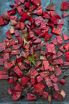 chopped beets on a baking sheet with herbs