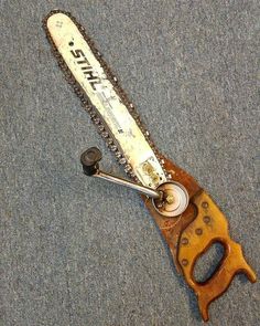 an old chainsaw is laying on the ground with words written below it that read, drubba lu'd'dorel