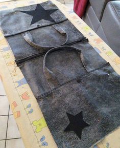 the bag is made out of old jeans and has a black star on it's side