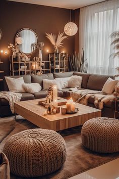 a living room filled with lots of furniture and candles on top of it's coffee table