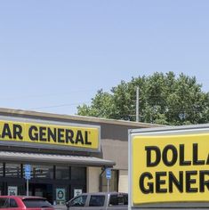 a dollar general store with cars parked in front