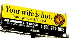 a yellow and black advertisement for a hot air conditioner on the side of a building