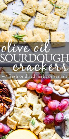 grapes, crackers and cheese on a tray with the words live - o'sourdough crackers