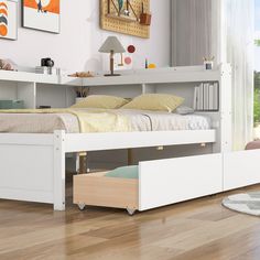 a white bed sitting on top of a wooden floor