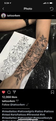 a woman's arm with flowers on it