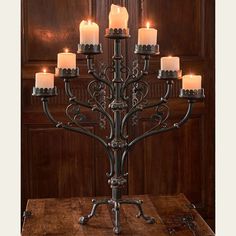 a large metal candelabra with lit candles