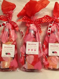 three bags filled with valentine's day treats