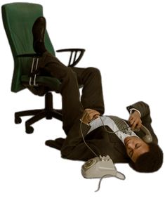 a man is laying on the floor with his feet up and headphones in his ears