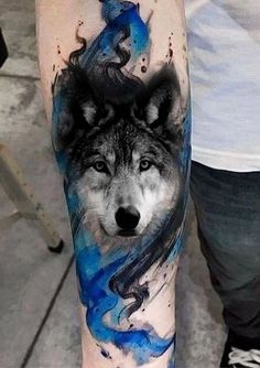 a man with a wolf tattoo on his arm