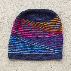 a knitted hat laying on the ground