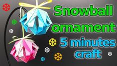 the snowball ornament 5 minutes craft is made with colored paper and ribbon