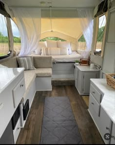 the inside of a camper with lots of windows