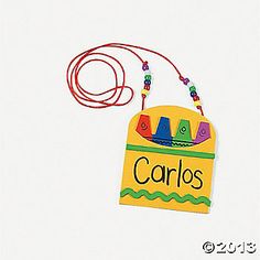 a colorful name tag hanging from a red string