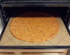 an uncooked pizza is in the oven ready to be baked